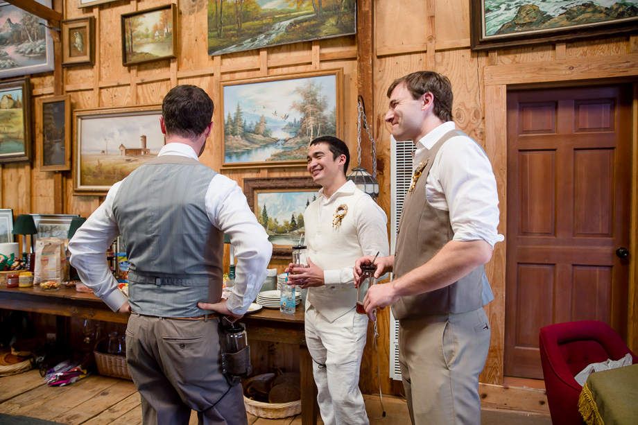 guys chatting and drinking in the barn