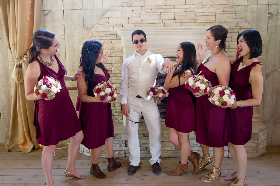 groom with bridesmaids photo