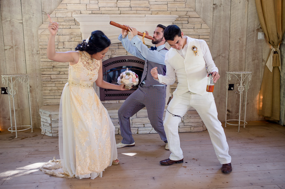 happy couple dancing with their officiant