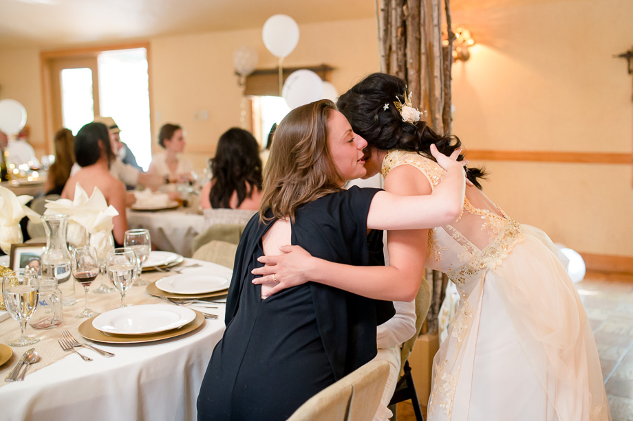 bride hugging with a guest