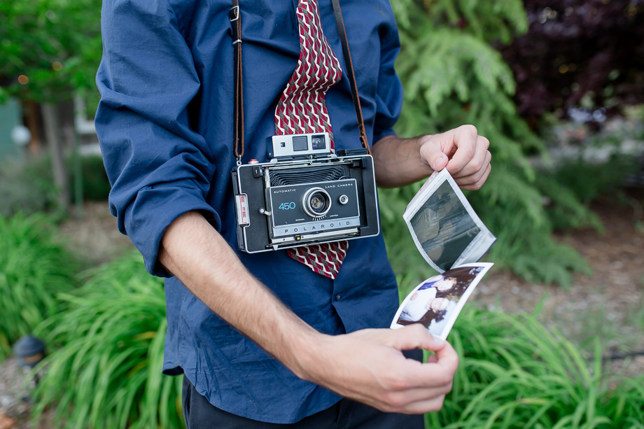 Wedding guest with a cool polaroid camera