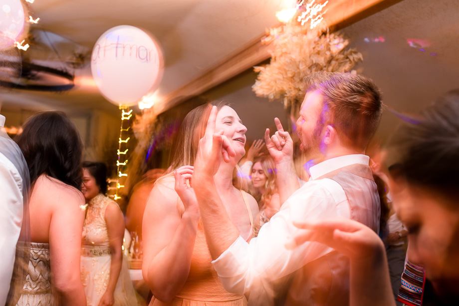 wedding guests dancing at the reception