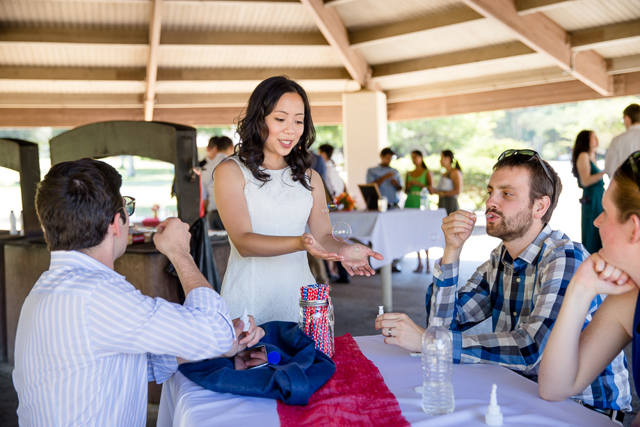 bride having fun with the bubbles
