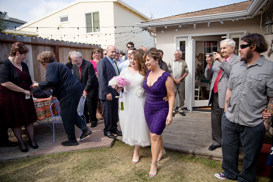 bride walking down the aisle with mom