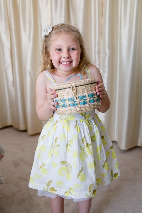 flower girl with her grandmas sewing kit