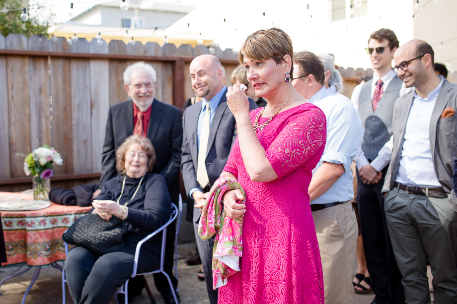 grooms mom tearing up during vow exchange
