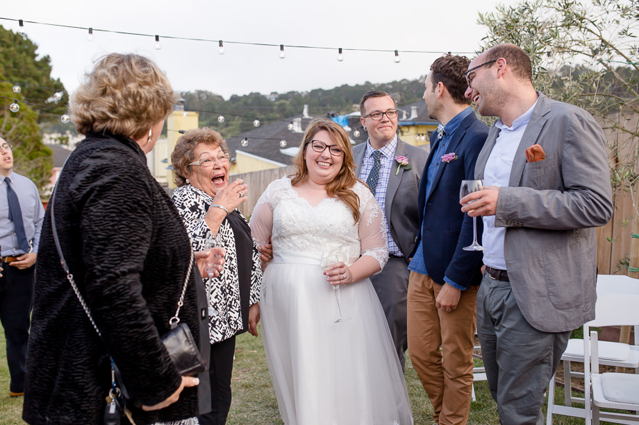 newlyweds mingling with family and friends during cocktail hour