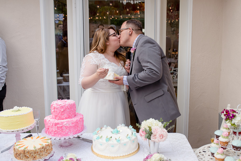 bride and groom feeding each other cake