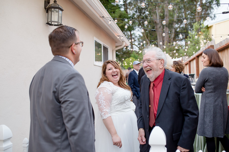 bride and groom chatting happily with their guests