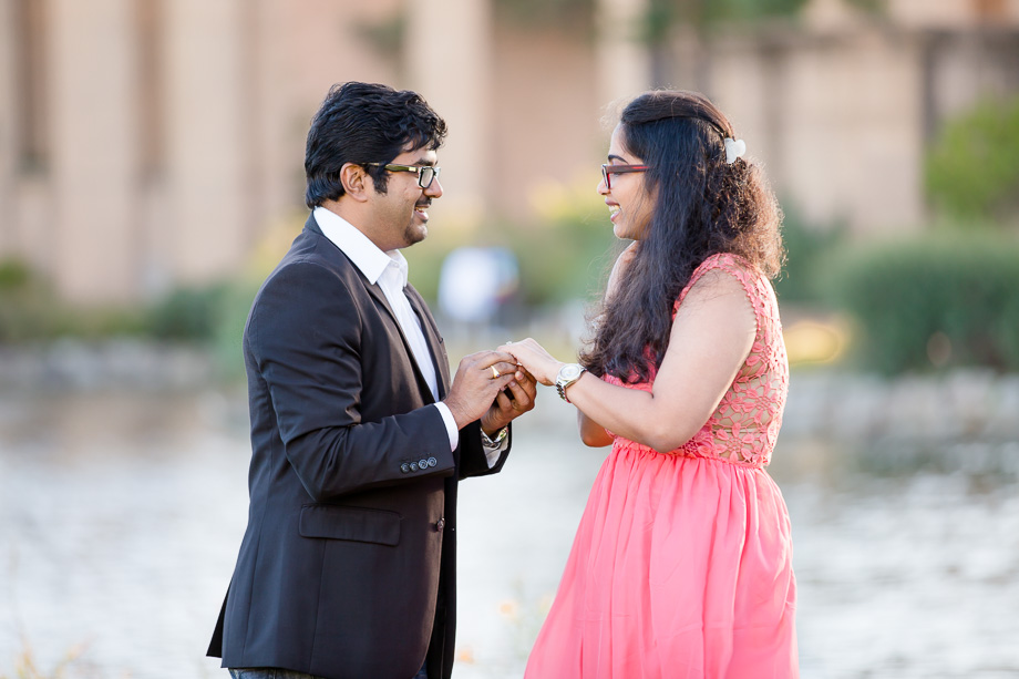 puuting on the engagement ring on for her