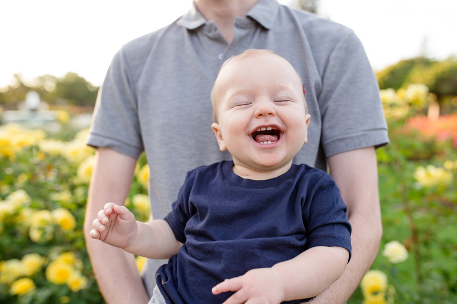 baby boy laughing in daddys arms - san jose municipal rose garden
