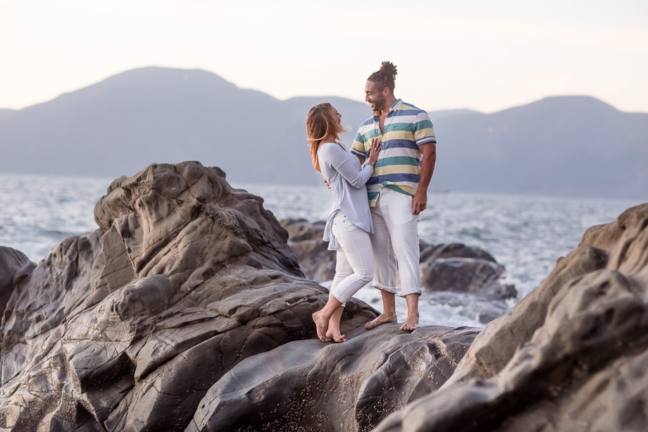 rock and beach engagement photo