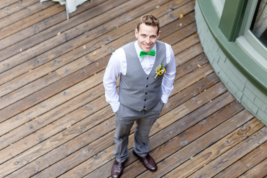 groom waiting downstairs for the first look