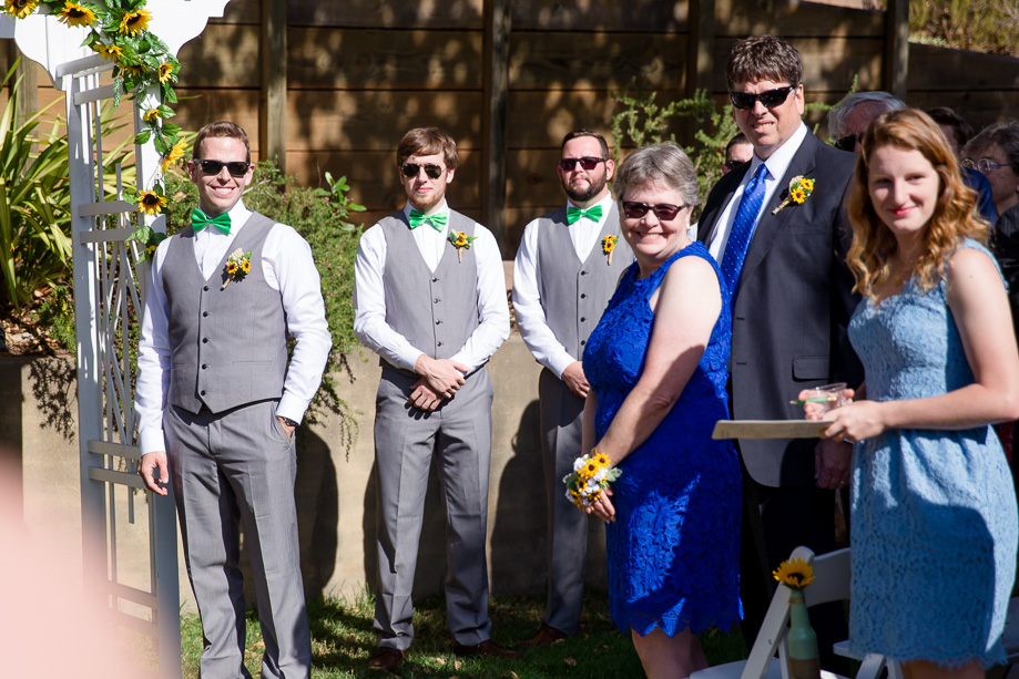 groom happily waiting for the bride to walk down the aisle