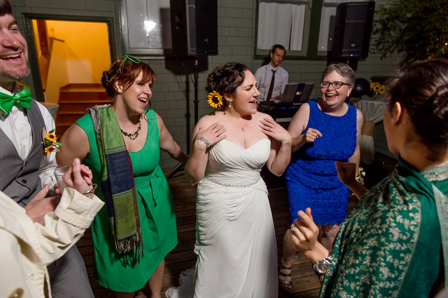 bride having fun at her wedding reception dance party
