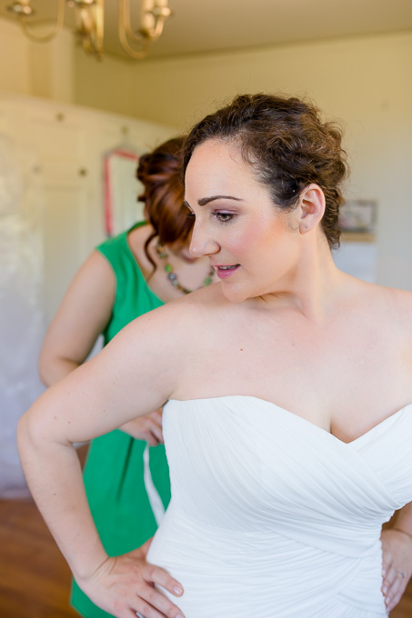 bride getting into her dress