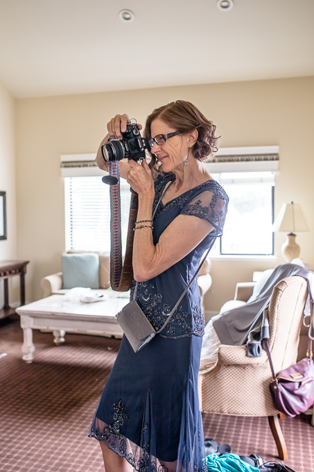 brides mother taking photos of the bride