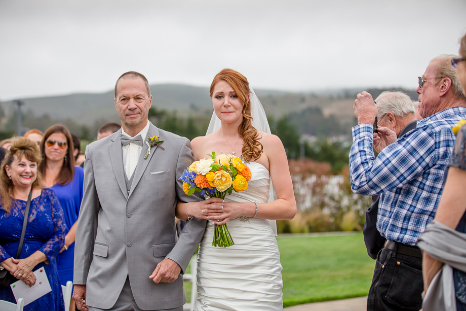 bride is getting emotional during the processional