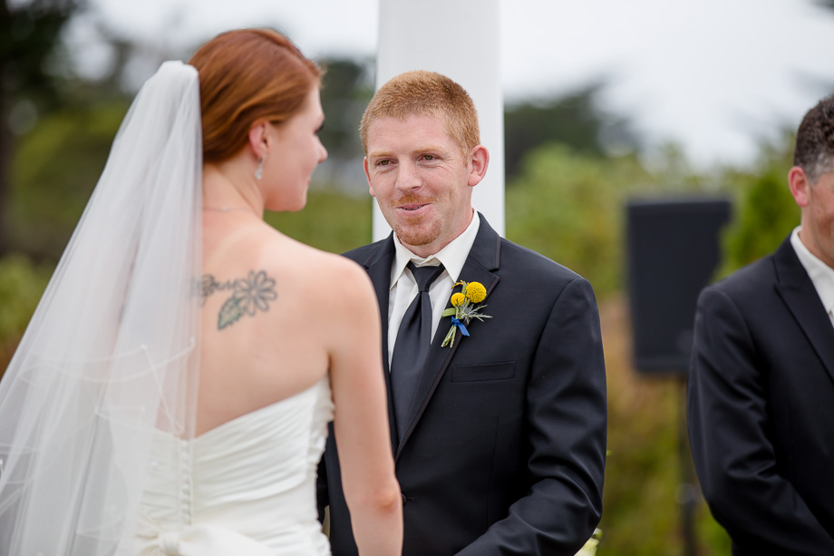 groom looking at his soon to be wife at the ceremony