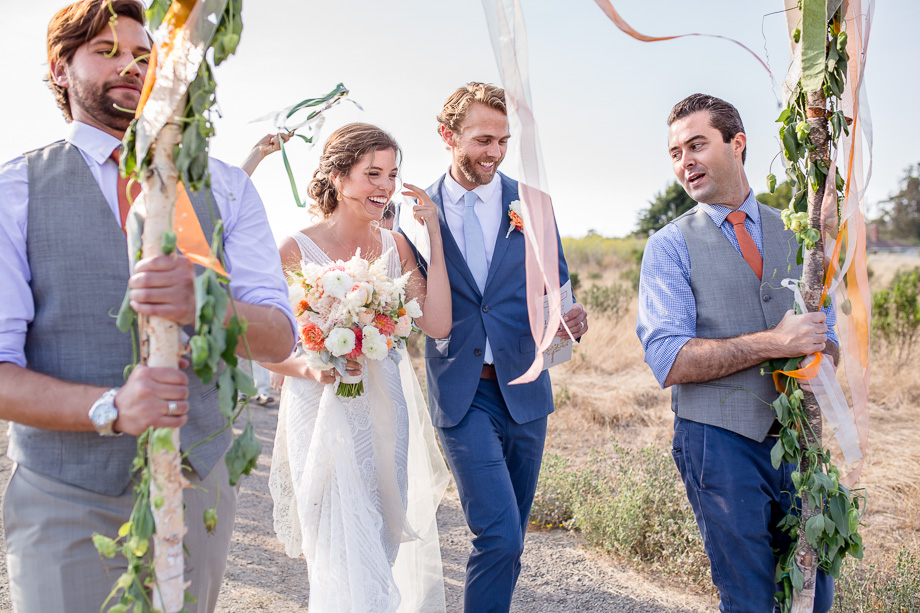 sweet candid moment captured during a wedding parade - Bay Area journalistic wedding photographer