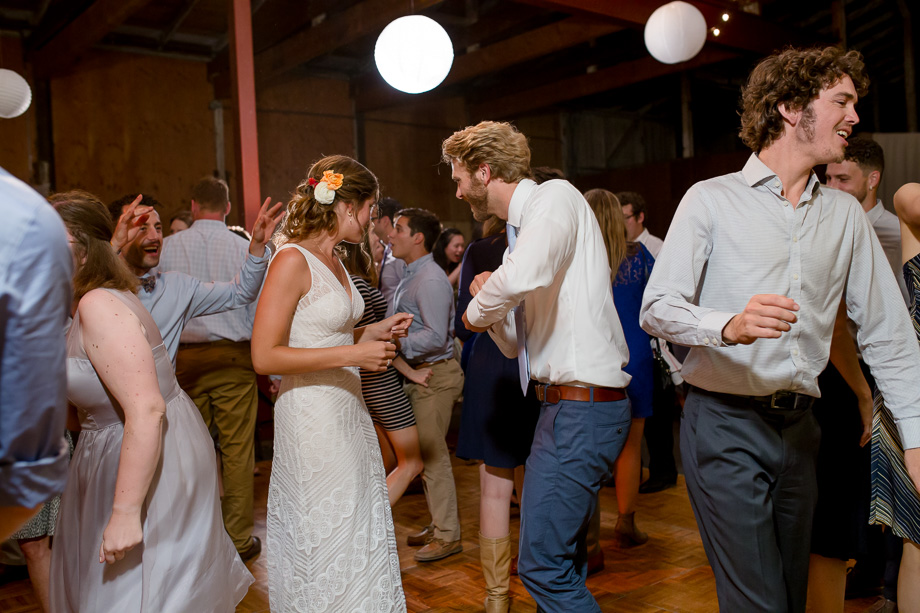 bride and groom dancing with guests