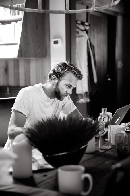 groom writing his wedding vows at a cute vacation home in Point Reyes Station