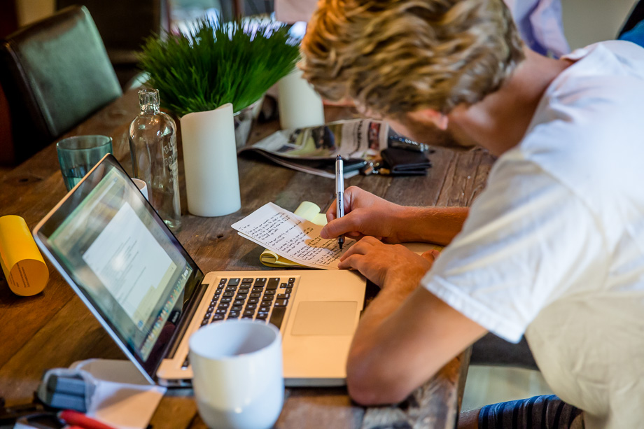 groom writing his wedding vows