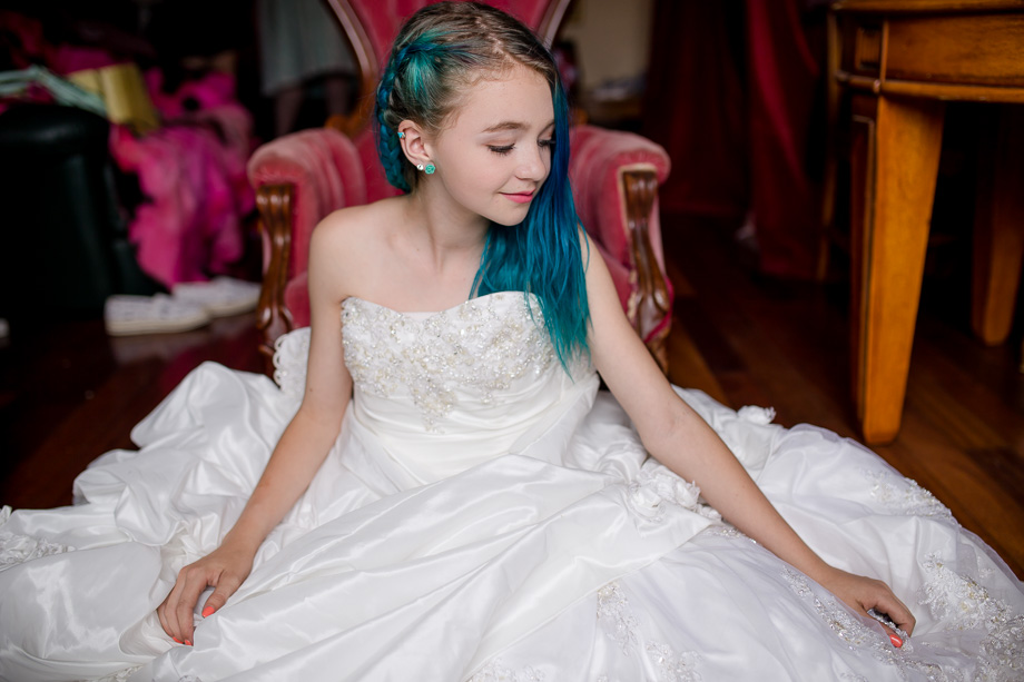 brides daughter in moms wedding dress