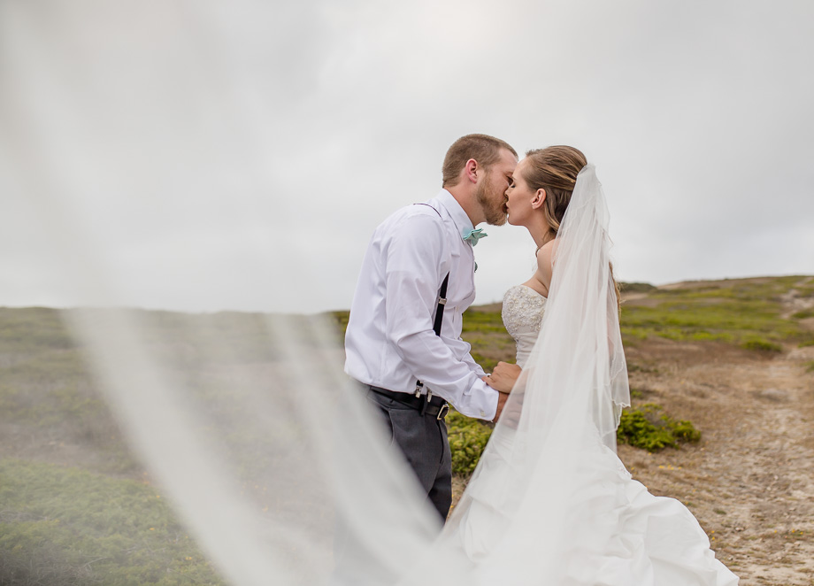 half moon bay wedding photo on a small hill