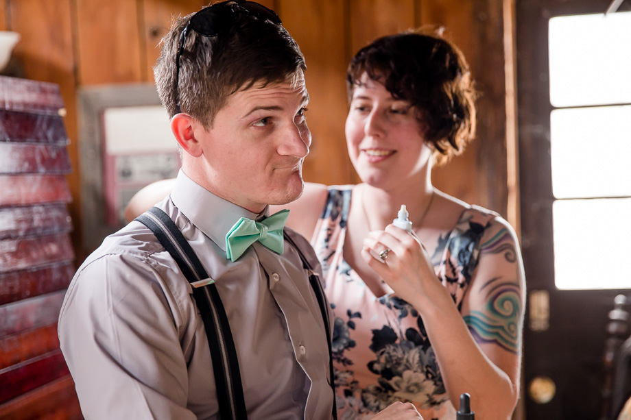 helping to dress the groomsman
