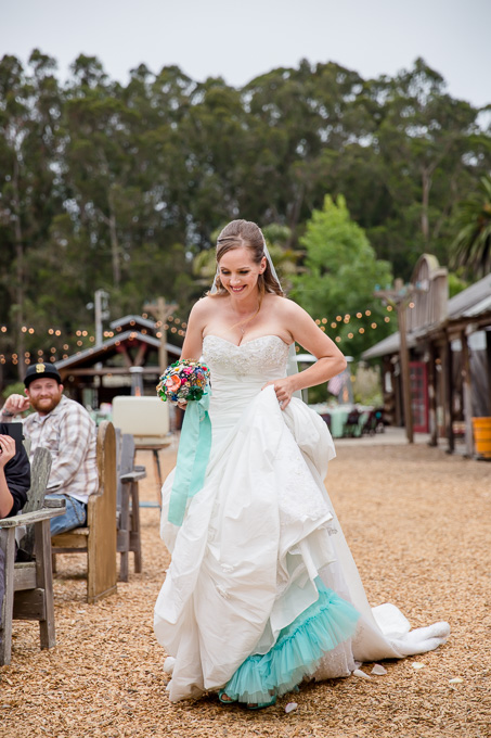bride walking down the aisle at long branch saloon