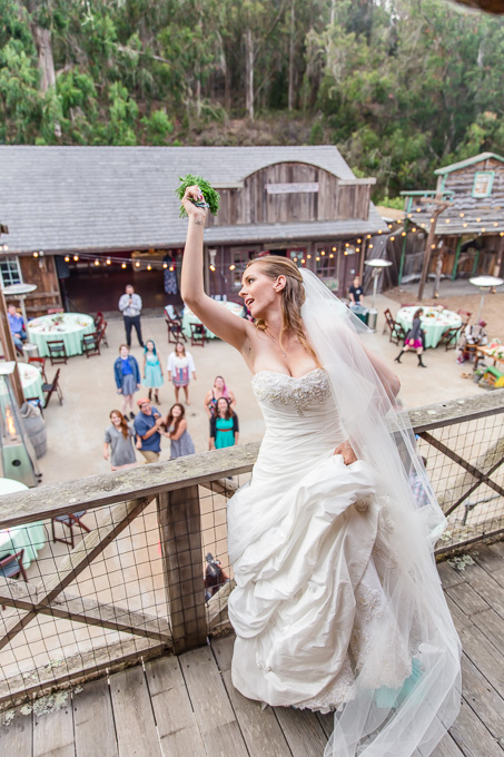 bouquet toss from second floor balcony in a farm house