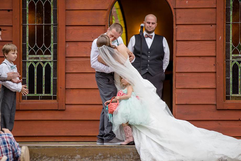 a dip and kiss in front of the red chapel