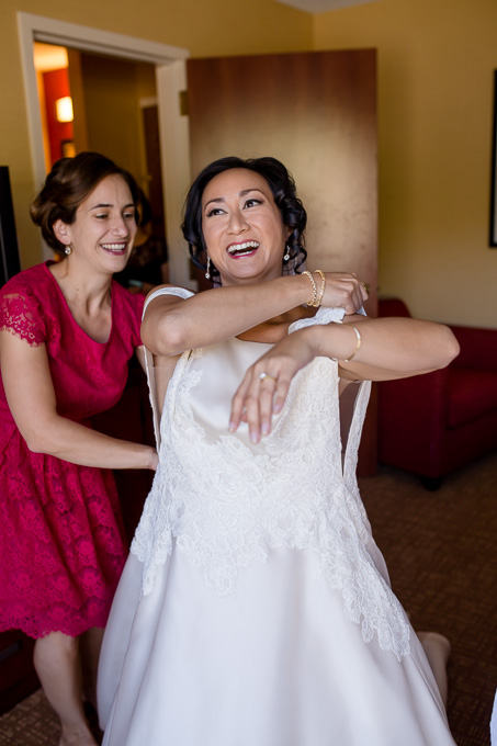 bride getting into her dress