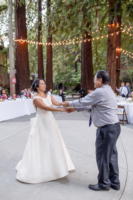 father daughter dance under cafe lights