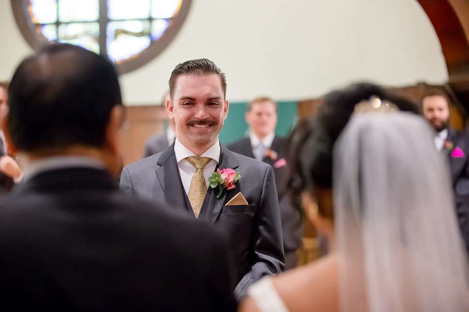 groom watching her bride walking down the aisle at St. Anselm Church