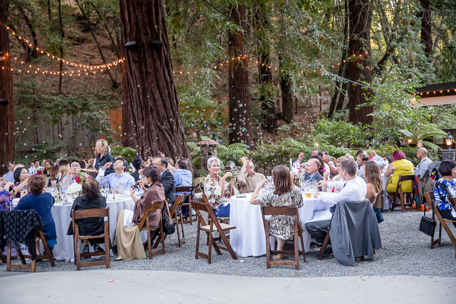 Deer Park Villa blowing bubbles and string lighting wedding reception