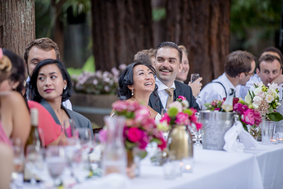 bride and groom enjoying toasts with laughter