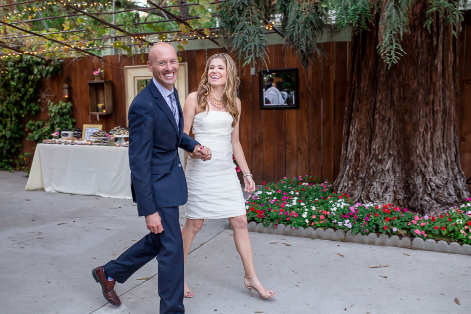 bride and groom walking towards reception