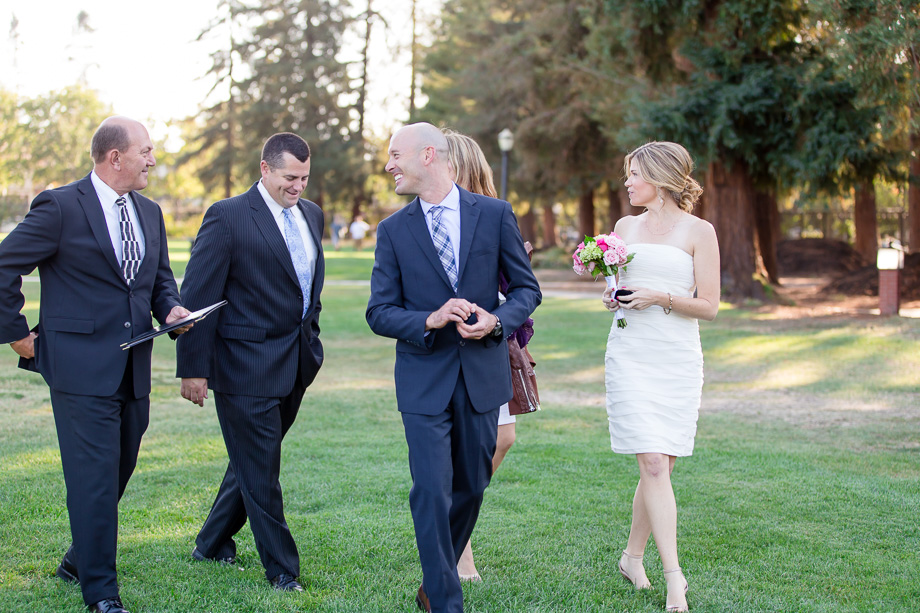 intimate wedding party walking in park