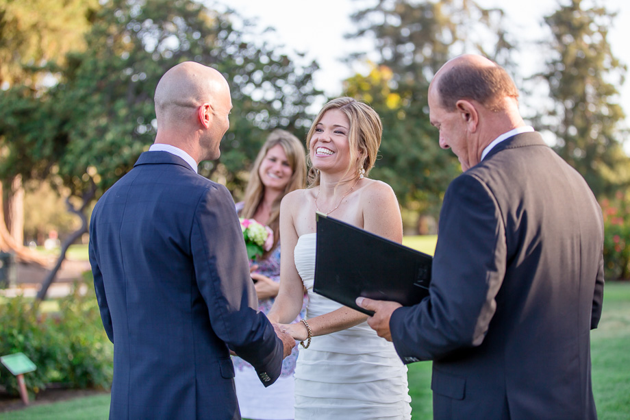 bride smiling at groom during wedding ceremony