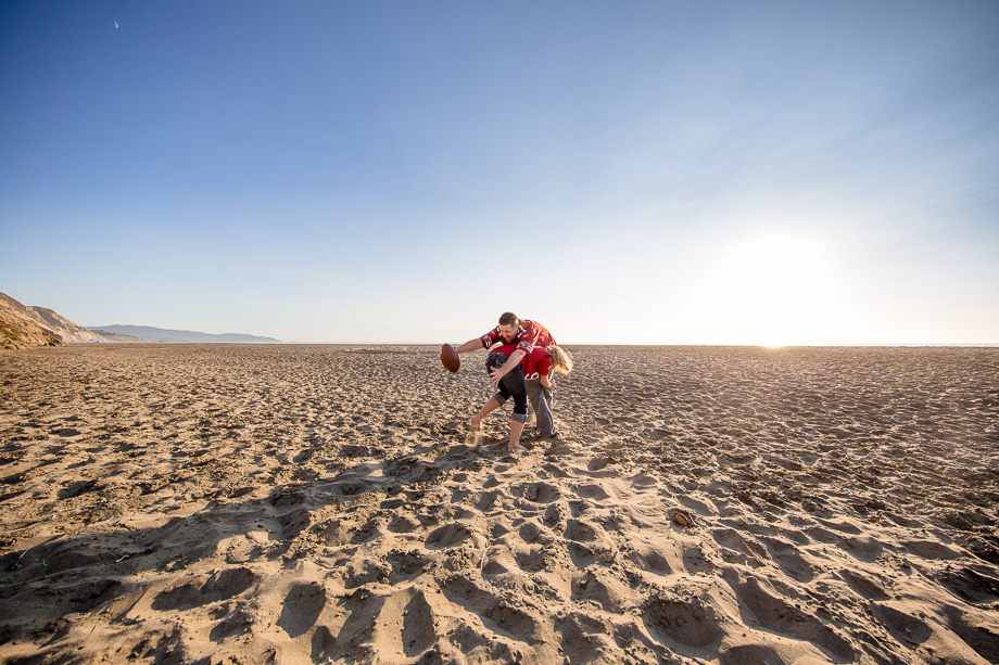 football tackle engagement photo on beach
