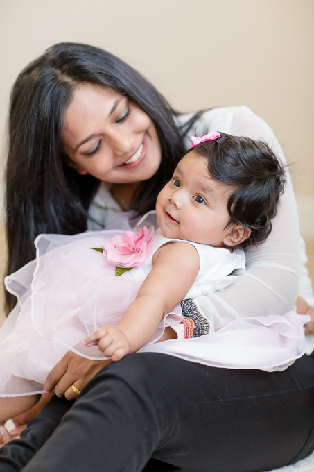 family photo of mother looking at baby