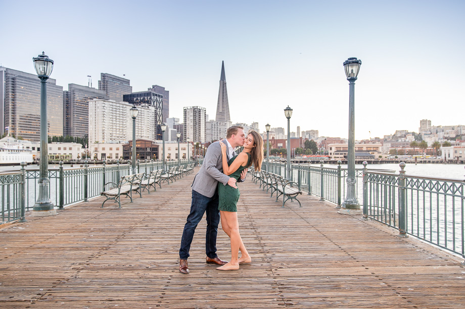 beautiful sunset couple engagement portrait on pier 7 after the surprise proposal
