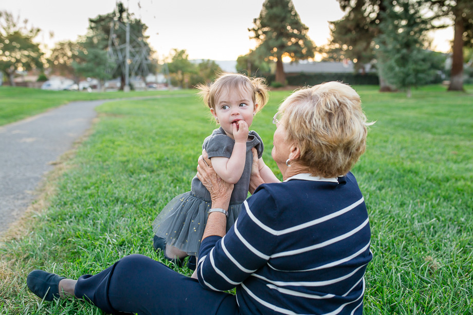 grandma and baby in grassy park