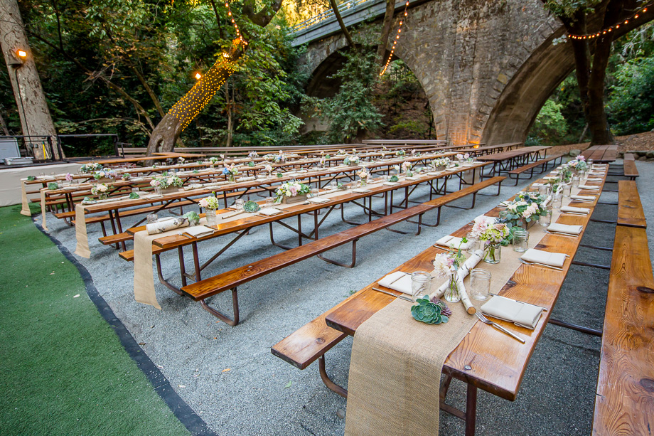 beautiful rustic reception long picnic table setup at Saratoga Springs