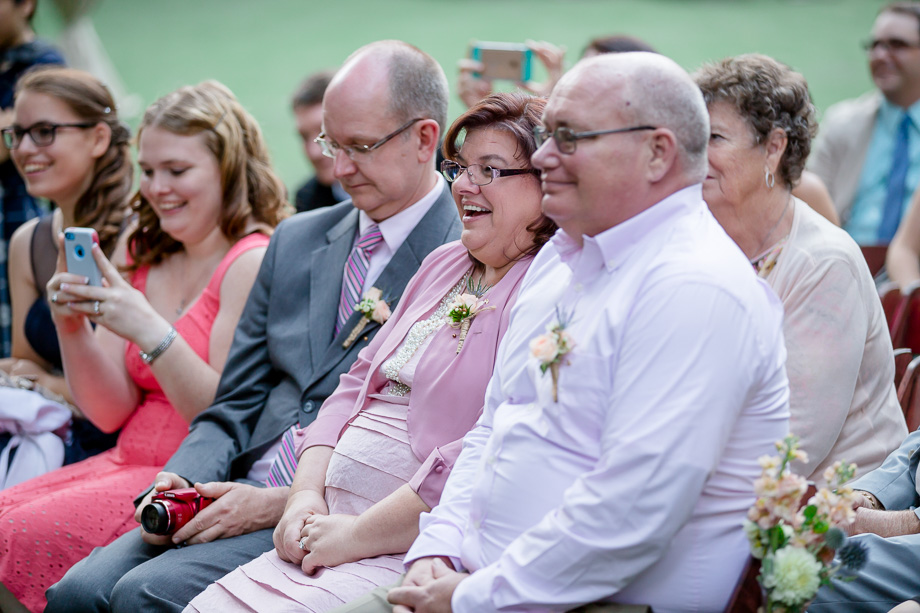 family looking on wedding ceremony