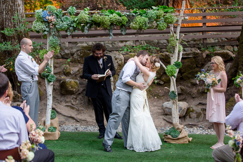 bride and groom first kiss at Saratoga Springs
