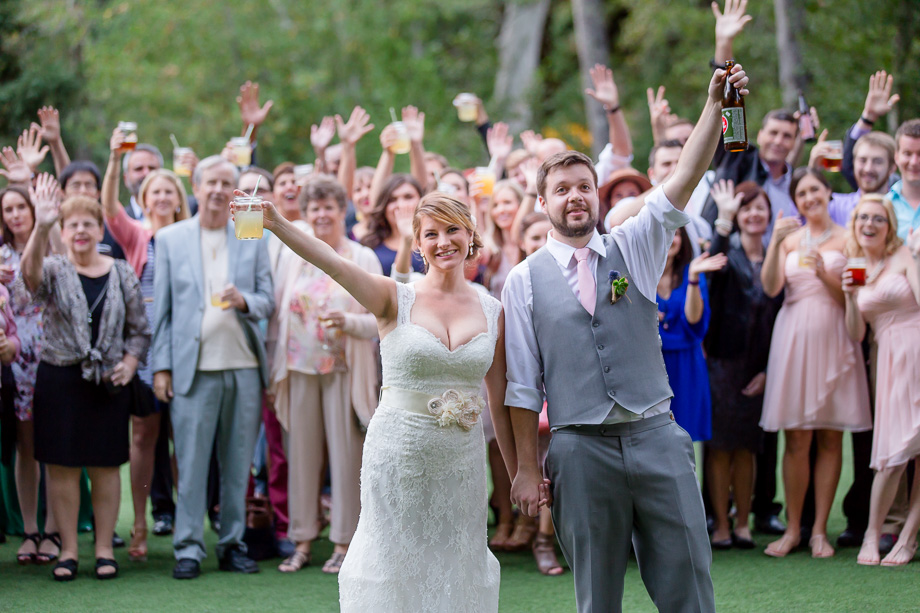 big group photo with bride and groom and guests