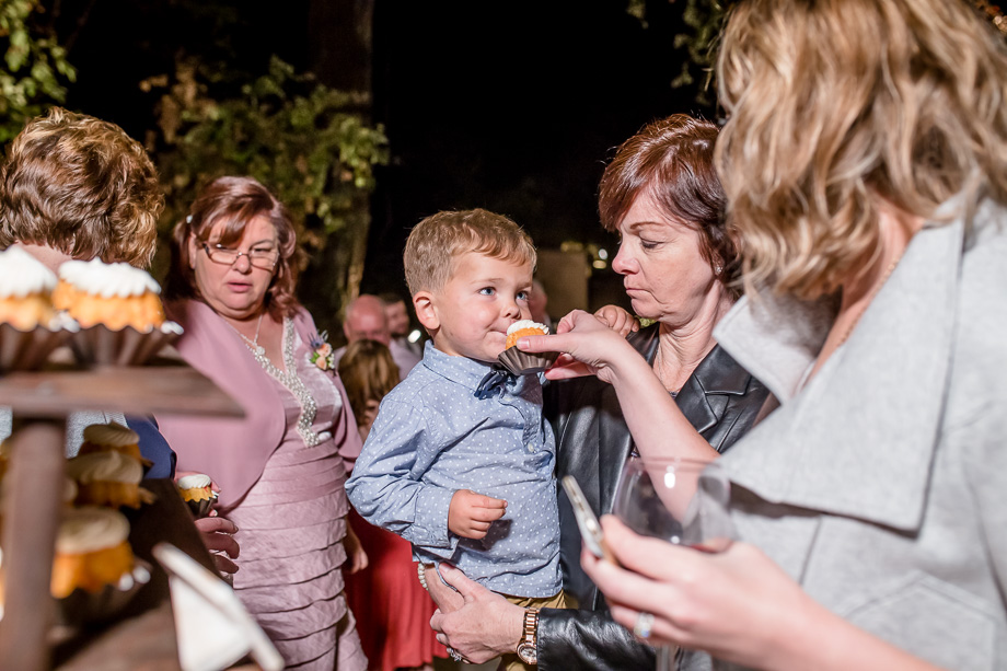 feeding little boy a cupcake